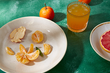 Image showing mandarins, grapefruit and glass of juice