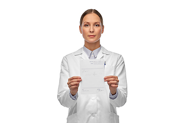 Image showing female doctor with prescription blank