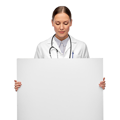 Image showing female doctor holding white board