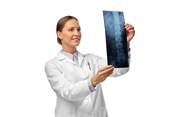 Image showing happy smiling female doctor with x-ray of spine