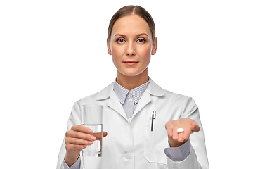 Image showing female doctor with medicine and glass of water