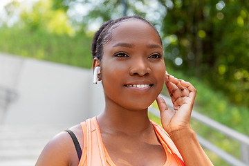 Image showing happy african american woman with earphones