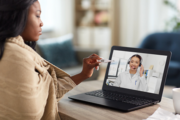 Image showing sick woman having video call with doctor on laptop