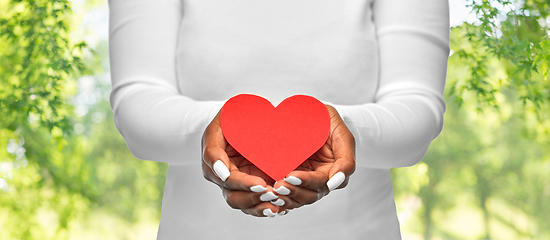 Image showing close up of african american woman with red heart