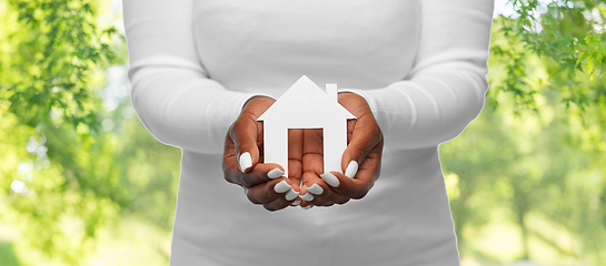 Image showing hands of african american woman holding house