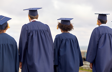 Image showing graduate students or bachelors in mortar boards