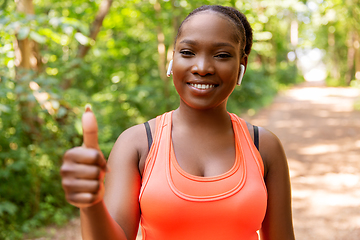 Image showing happy african american woman with headphones