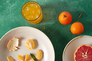 Image showing mandarins, grapefruit and glass of juice