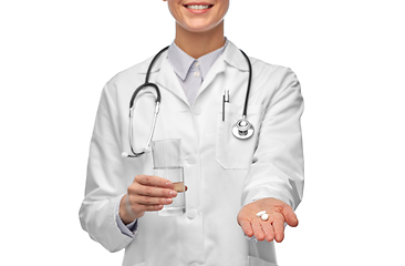 Image showing doctor with medicine and glass of water