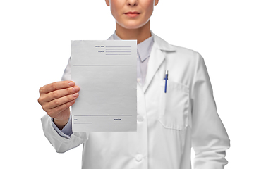 Image showing close up of female doctor with prescription blank