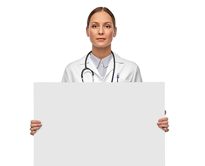 Image showing female doctor holding white board