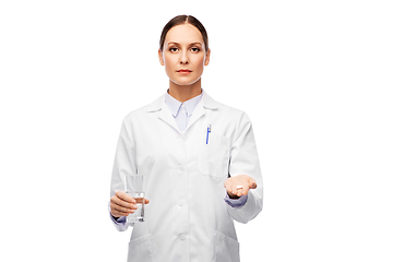 Image showing doctor with medicine and glass of water