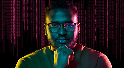 Image showing young african american man over binary code