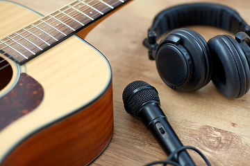 Image showing close up of guitar, microphone and headphones