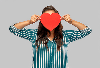 Image showing woman covering her face with red heart