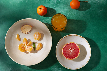 Image showing mandarins, grapefruit and glass of juice