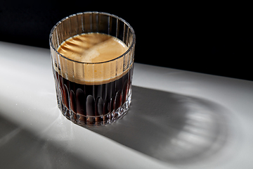 Image showing glass of coffee on table