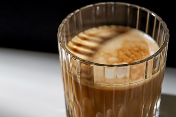 Image showing close up of coffee in glass on table