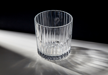 Image showing empty faceted glass on table