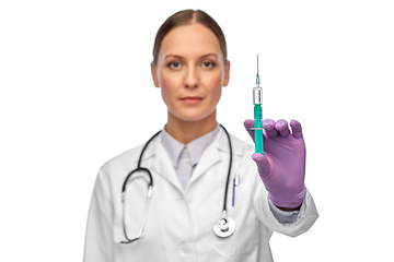 Image showing female doctor with medicine in syringe