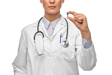 Image showing close up of female doctor holding medicine pill