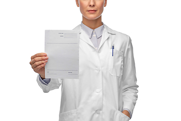 Image showing close up of female doctor with prescription blank