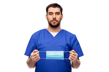 Image showing male doctor in blue uniform with mask