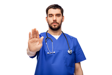 Image showing doctor or male nurse showing stop gesture