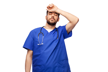 Image showing tired doctor or male nurse with stethoscope