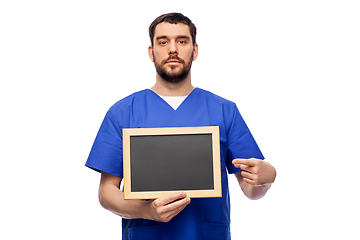 Image showing male doctor or nurse with chalkboard