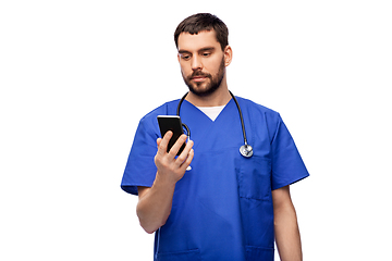 Image showing doctor or male nurse using smartphone