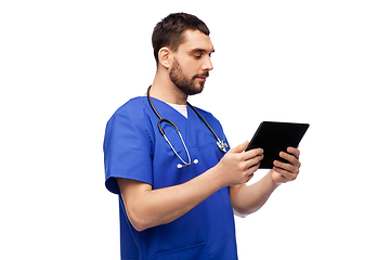 Image showing doctor or male nurse using tablet computer