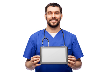 Image showing happy doctor or male nurse showing tablet computer