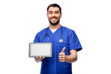 Image showing male doctor with tablet pc showing thumbs up