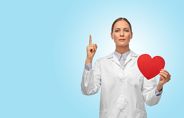 Image showing female doctor with heart pointing finger up