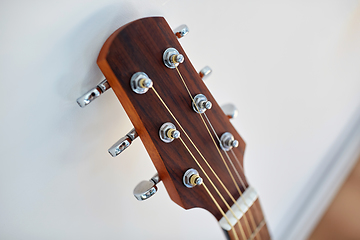 Image showing close up of acoustic guitar head with pegs