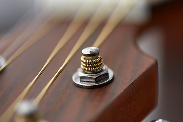 Image showing close up of acoustic guitar head with pegs