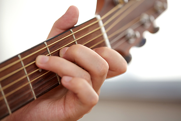 Image showing close up of hand with guitar neck playing music