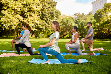 Image showing group of people doing yoga at summer park