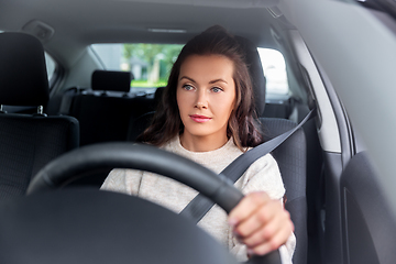 Image showing woman or female driver driving car in city