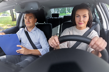 Image showing car driving school instructor and young driver