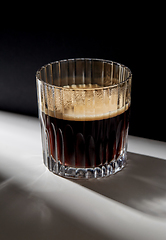 Image showing glass of coffee on table