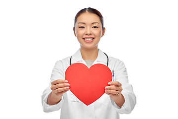 Image showing smiling asian female doctor holding red heart