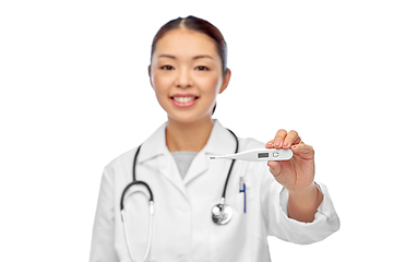 Image showing smiling asian female doctor with thermometer