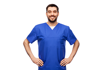 Image showing happy smiling doctor or male nurse in blue uniform