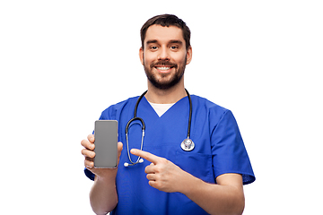 Image showing smiling doctor or male nurse with smartphone