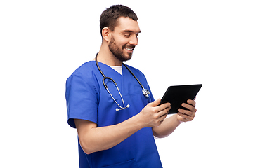 Image showing smiling doctor or male nurse using tablet computer