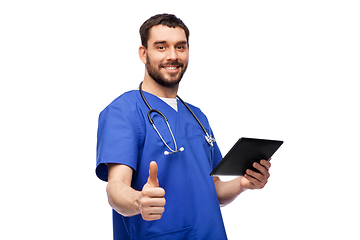 Image showing male doctor with tablet pc showing thumbs up