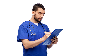 Image showing male doctor writing medical report on clipboard