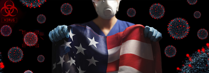 Image showing doctor in goggles and mask holding flag of america